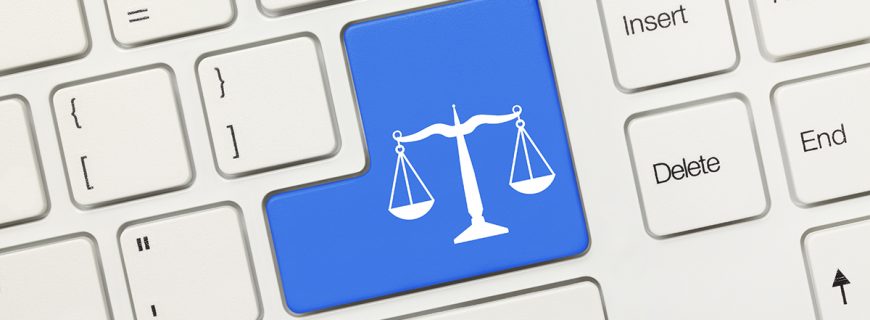Close-up view on white conceptual keyboard - Law symbol (blue key)